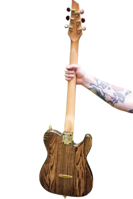 Wood-body Tele-style guitar held up by its neck, with a tattooed forearm showing.