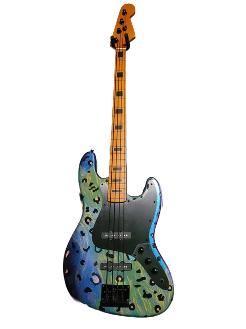 Bass guitar with a colorful blue and green painted body and an orange maple neck.
